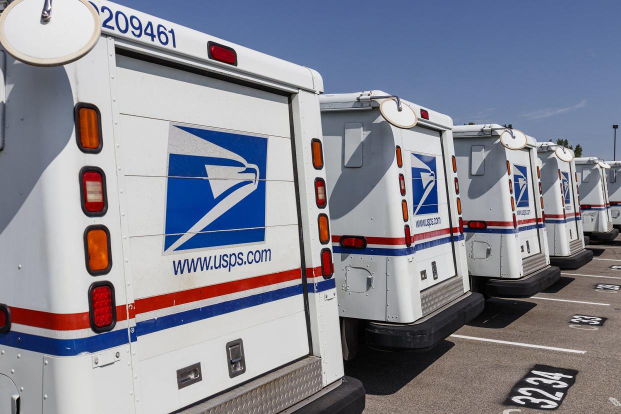 Indianapolis - Circa August 2019: USPS Post Office Mail Trucks. The Post Office is responsible for providing mail delivery VIII