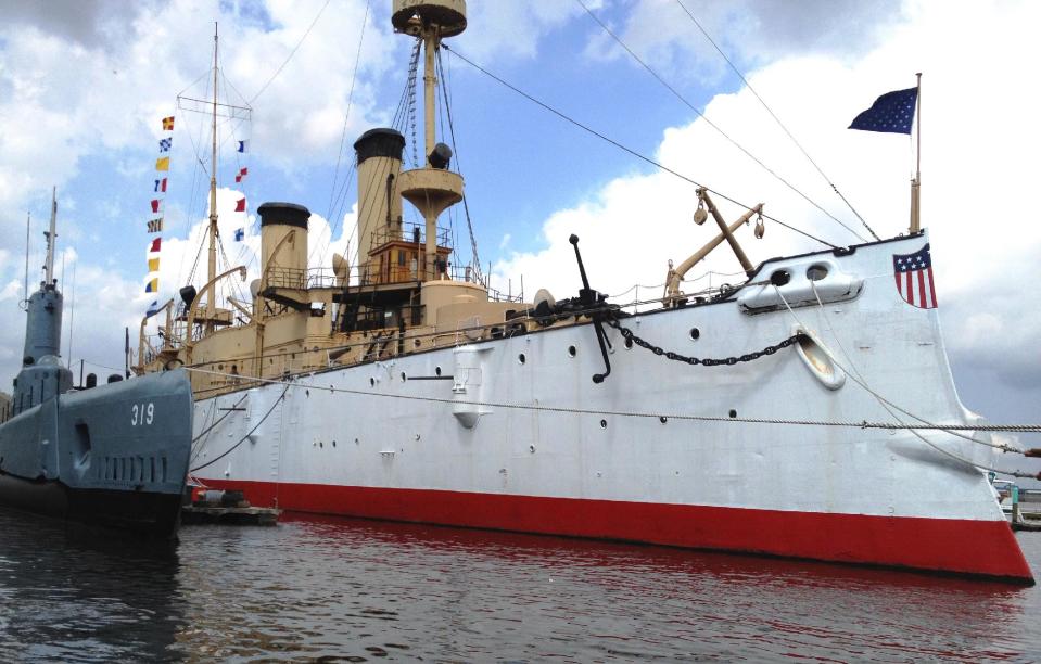 This undated photo provided by the Independence Seaport Museum from August 2012, shows the USS Olympia moored beside the submarine USS Becuna in Philadelphia. The USS Olympia, a one-of-a-kind steel cruiser from the Spanish-American War, has undergone extensive repairs that make it more stable than it has been in years as the field for prospective caretaker has narrowed to groups in San Francisco and South Carolina. (AP Photo/Hope Koseff Corse-Independence Seaport Museum)