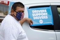 FILE PHOTO: Uber and Lyft drivers demonstrate over basic employee rights in California