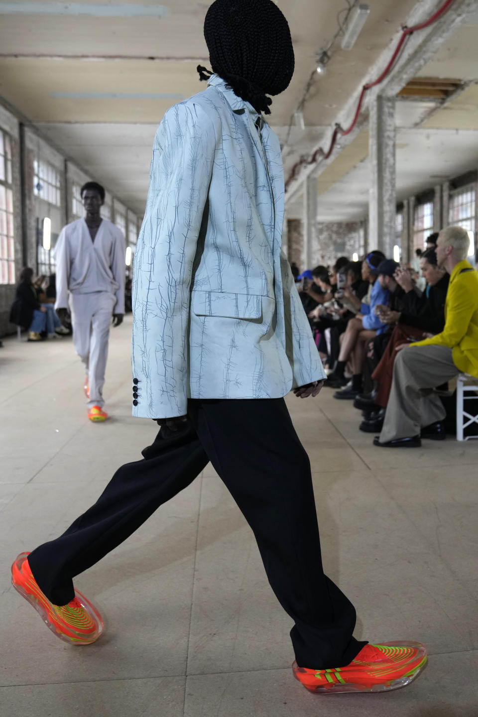 A model wears a creation for Botter for the ready-to-wear Spring/Summer 2023 fashion collection presented Tuesday, Sept. 27, 2022 in Paris. (AP Photo/Francois Mori)