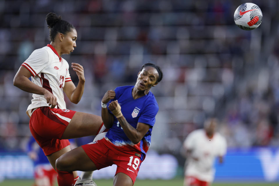 Canada's Jade Rose, left, kicks the ball away from United States' Crystal Dunn during the first half of a SheBelieves Cup soccer match Tuesday, April 9, 2024, in Columbus, Ohio. (AP Photo/Jay LaPrete)
