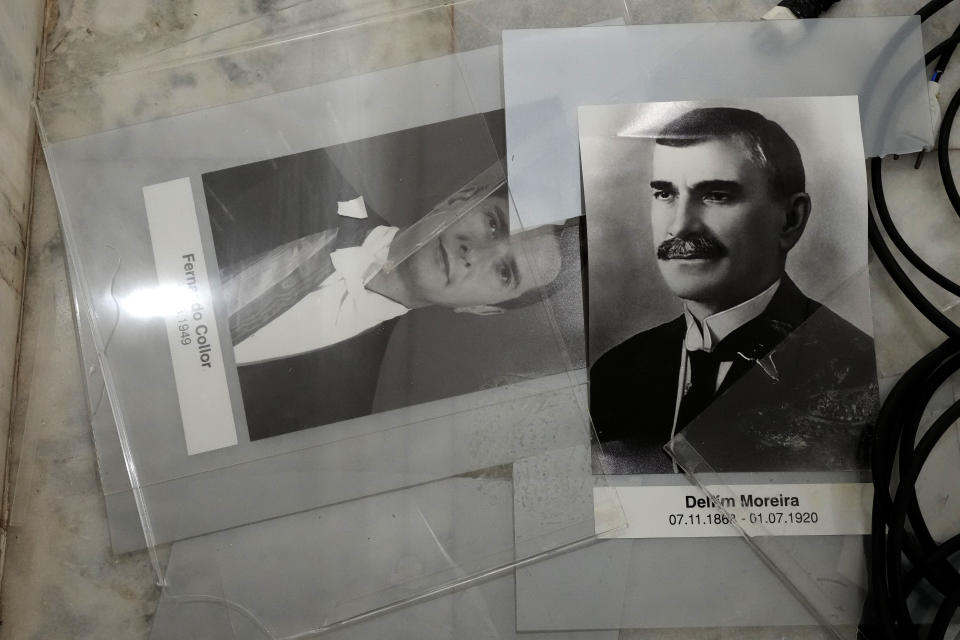 Portraits of former Brazilian President Fernando Collor, left, and Delfim Moreira, from the gallery of former presidents, lay scattered on the floor of the lobby of Planalto Palace, the office of the president, the day after it was stormed by supporters of Brazil's former President Jair Bolsonaro in Brasilia, Brazil, Monday, Jan. 9, 2023. The protesters also stormed Congress and the Supreme Court. (AP Photo/Eraldo Peres)