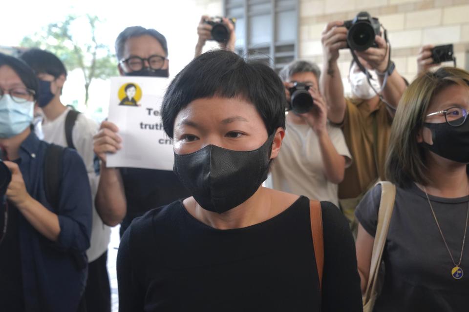 Hong Kong journalist Choy Yuk-ling, also known as Bao Choy, arrives a court in Hong Kong Thursday, April 22, 2021. Hong Kong journalist Choy appeared in court on Thursday for verdict on charges of making false statements while obtaining information from a vehicle database. Choy, a producer at public broadcaster Radio Television Hong Kong, was arrested in Nov. 2020. She was involved in the production of an investigative documentary into the behavior of Hong Kong police during 2019 anti-government protests, after the force was accused of not intervening during a violent clash between protesters and a mob of men in a subway station. (AP Photo/Kin Cheung)