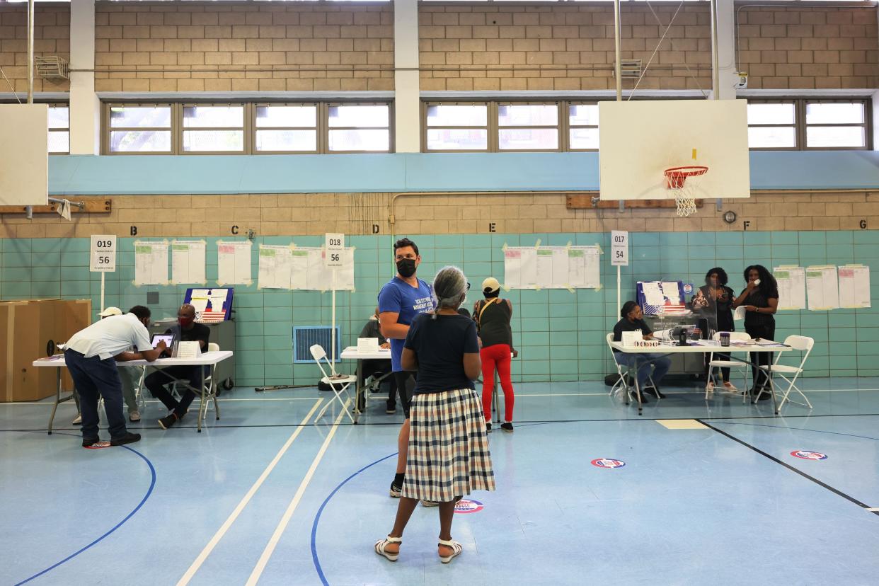 People prepare to vote during the Primary Election Day at P.S. 81 on June 22, 2021, in the Bedford-Stuyvesant neighborhood of Brooklyn.