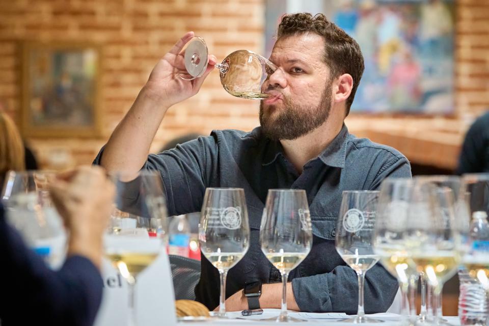 Thomas Greer tastes a white wine during the 2023 azcentral Arizona Wine Competition on Feb. 27, 2023, at The Newton in Phoenix.