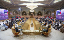 FILE - In this Monday, Oct. 25, 2021 file photo, provided by the Saudi Royal Palace, heads of state and senior officials attend the Green Initiative Summit in Riyadh, Saudi Arabia. The global energy transition is perhaps nowhere more perplexing than in the Arabian Peninsula. Gulf Arab states are privately and publicly advocating for carbon capture technologies rather than a rapid phasing out of burning fossil fuels, warning that a hurried transition would leave poorer populations without access to energy. (Bandar Aljaloud/Saudi Royal Palace via AP, File)