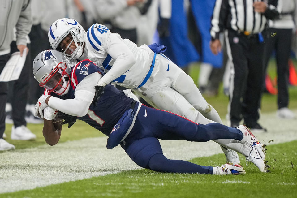 New England Patriots wide receiver JuJu Smith-Schuster (7) pulls in a pass against Indianapolis Colts cornerback Jaylon Jones (40) in the second half of an NFL football game in Frankfurt, Germany Sunday, Nov. 12, 2023. (AP Photo/Martin Meissner)
