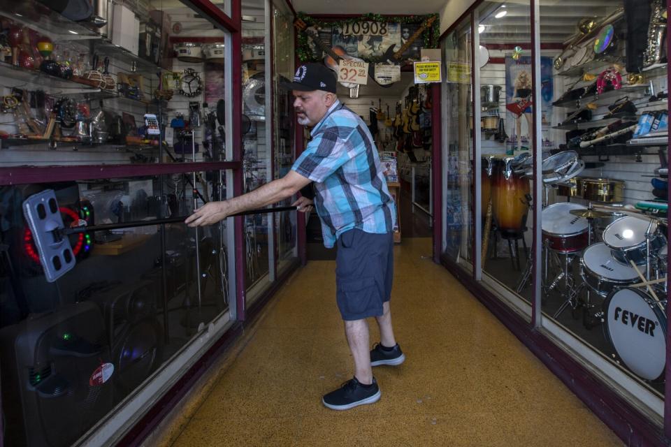 A man washes store windows.