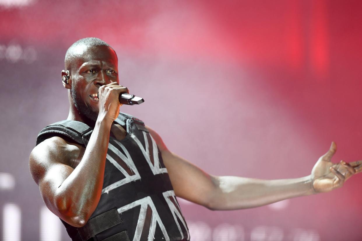 The rapper on stage at Glastonbury in June: his in-ear monitors blew twice during the set but he believes he was 'saved by God': Getty