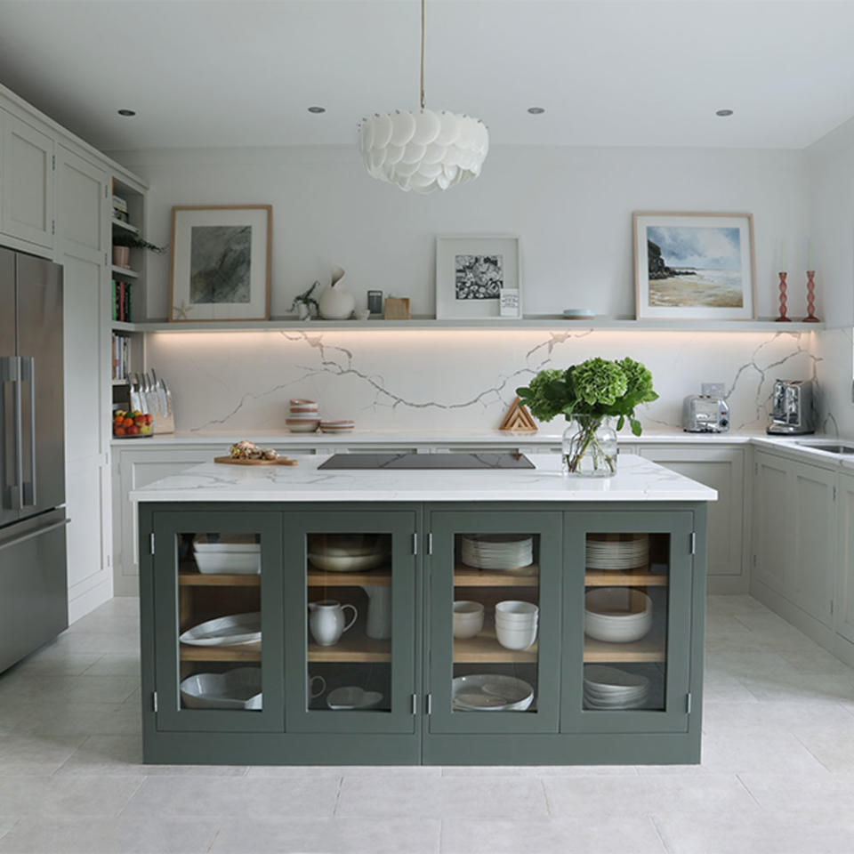 <p> In large kitchens with lots of cabinetry, pale worktops with light-reflective finishes can help break up solid blocks of colour and add visual interest to a space. </p> <p> For a central kitchen island with outward-facing cabinets, opt for glass door fronts in place of a solid bank of doors. Glass reflects light too, bouncing it across a room to further enhance the feeling of spaciousness. </p>