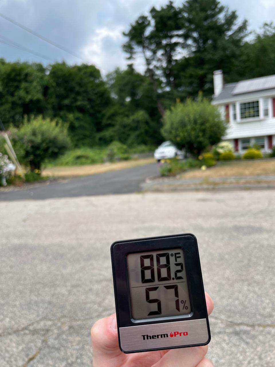 The temperature on Maplewood Circle in Brockton, just outside of Ames Nowell State Park, reads 88.2 degrees Fahrenheit — several degrees cooler than in downtown Brockton — on Thursday, July 28, 2022.