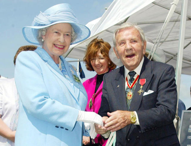 Queen Elizabeth II meets comedian Sir Norman Wisdom, during her visit to the Isle of Man in 2003 (Phil Noble/PA Archive/PA Images)