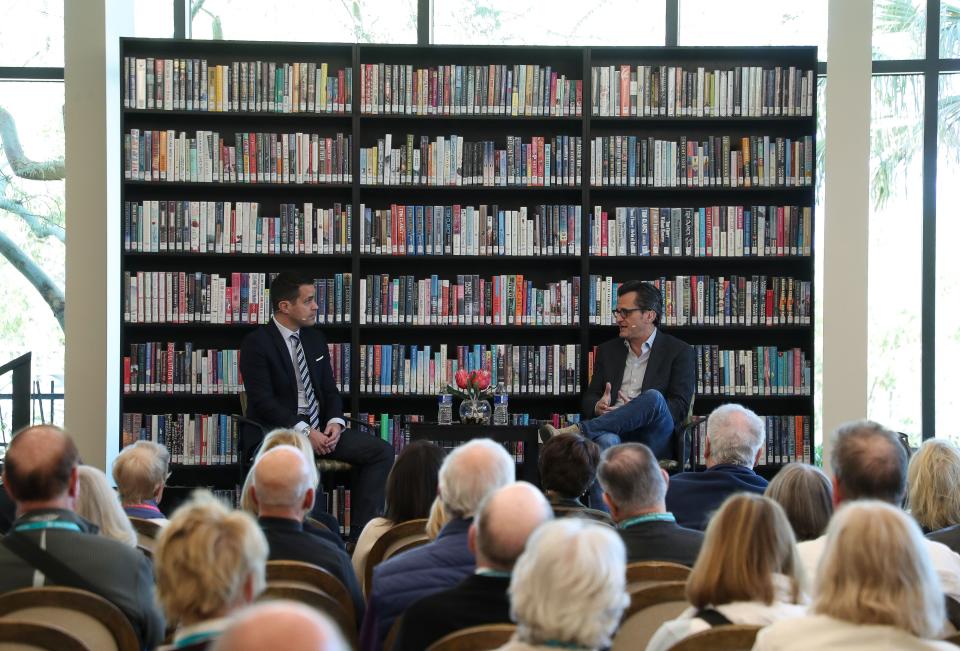 Ben Mankiewicz, right, speaks with Dave Karger during a discussion at the Rancho Mirage Writers Festival at the Rancho Mirage Public Library, February 1, 2023.  