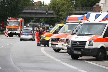 Ambulance cars and doctors are seen after a knife attack in a supermarket in Hamburg, Germany, July 28, 2017. REUTERS/Morris Mac Matzen