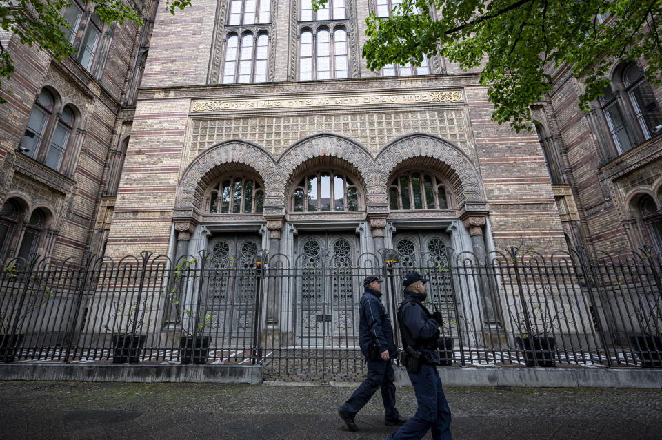 Two policemen secure the entrance to the New Synagogue Berlin, Germany, Friday, May 14, 2021. (Fabian Sommer/dpa via AP)