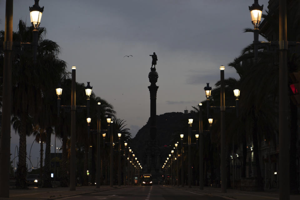 A seagull flies past the statue of Christopher Columbus in Barcelona, Spain, Thursday, July 2, 2020. Unlike in the United States, Britain and Belgium, statues of colonial-era figures have not become a major source of protests in Spain, which once ruled over one of the largest empires in history after conquering much of the Americas. Barcelona Mayor Ada Colau is one of the few public officials who say Spain must revisit its colonial legacy - though she is against timid calls to remove the city’s monument to Christopher Columbus. Instead, she tells The Associated Press that she encourages a public discussion about the Italian explorer whose landing in the Caribbean in 1492 gave birth to Spain’s overseas empire. (AP Photo/Renata Brito)