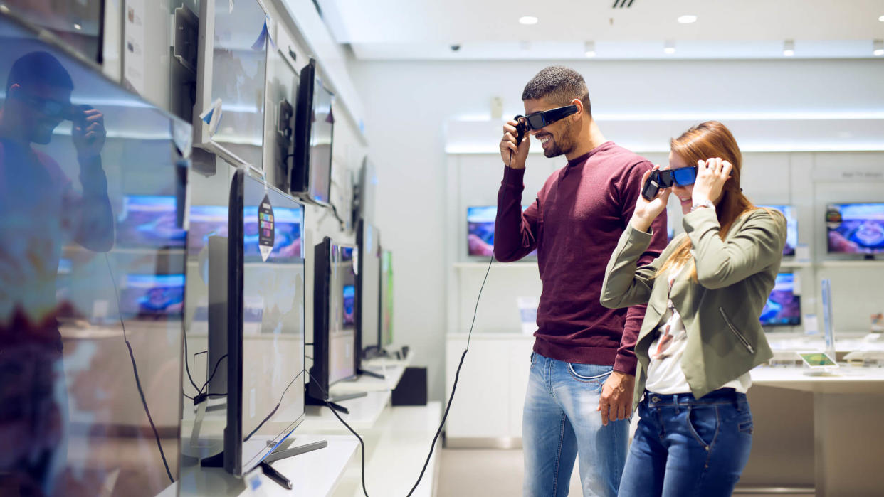 couple testing out new 3d tv