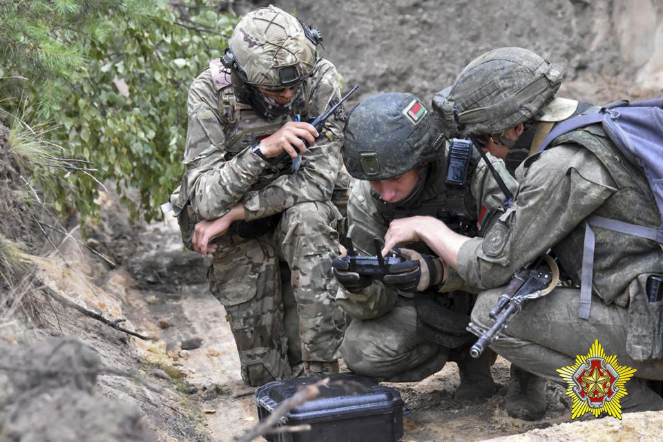 In this photo released by Belarus' Defense Ministry on Thursday, July 20, 2023, Belarusian soldiers of the Special Operations Forces (SOF) and mercenary fighters from Wagner private military company attend the weeklong maneuvers that will be conducted at a firing range near the border city of Brest, Belarus. Mercenaries from Russia's military company Wagner have launched joint drills with the Belarusian military near the border with Poland following their relocation to Belarus after their short-lived rebellion. (Belarus' Defense Ministry via AP)