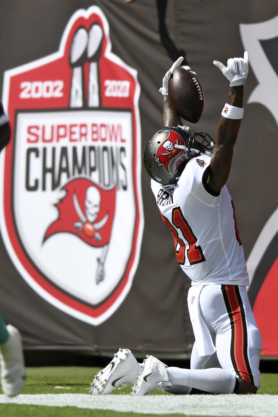 Tampa Bay Buccaneers wide receiver Antonio Brown (81) celebrates his 62-yard touchdown reception during the first half of an NFL football game against the Miami Dolphins Sunday, Oct. 10, 2021, in Tampa, Fla. (AP Photo/Jason Behnken)