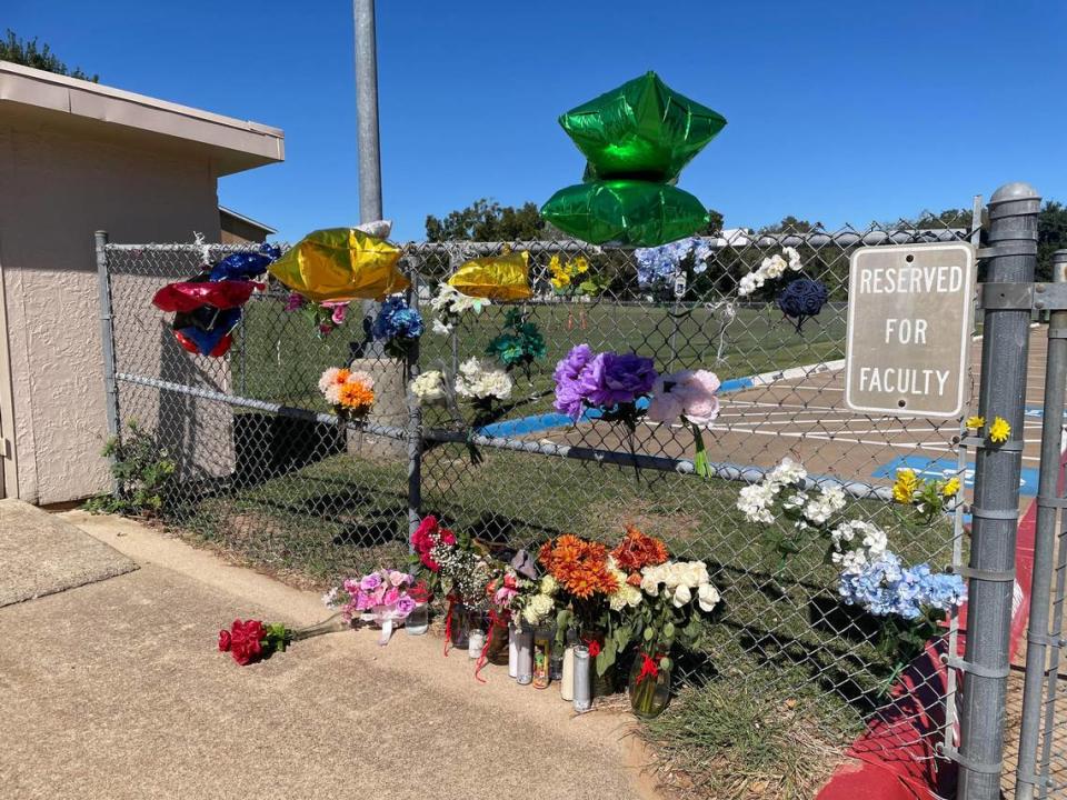 A memorial outside of David K. Sellars Elementary School in Forest Hill, Texas honors Yolanda Gibbs, who was fatally shot in the school’s back parking lot on Wednesday, Oct. 11, 2023.