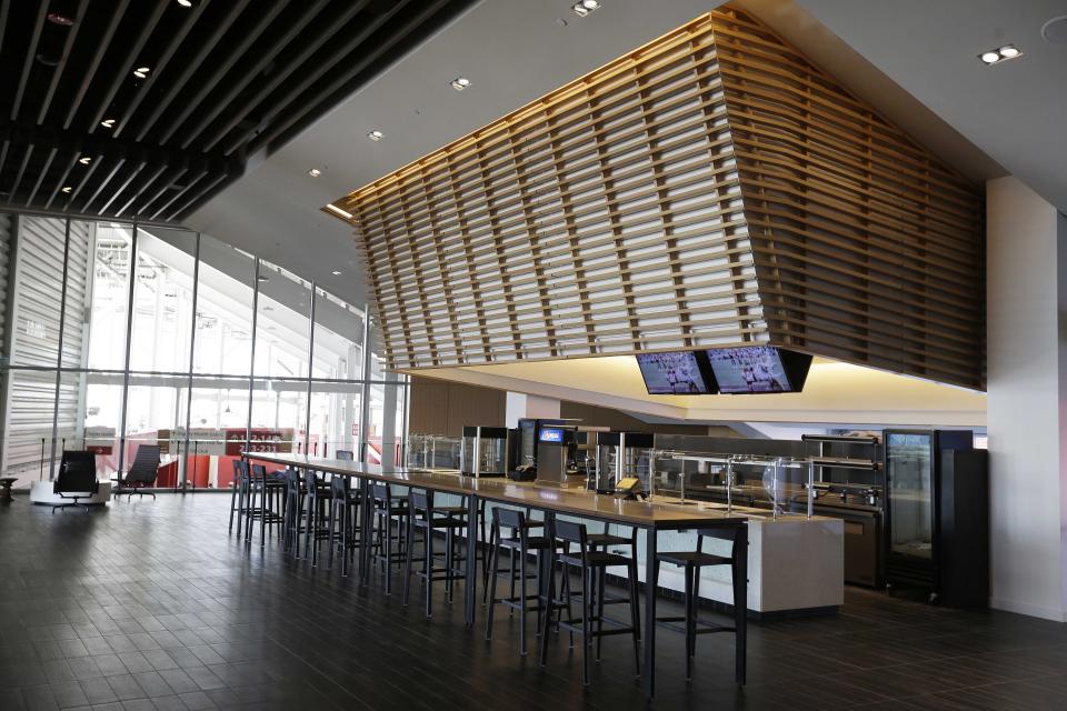 FILE - In this July 17, 2014, file photo, a food concession is shown inside the Levi's 501 Club on the opening day of Levi's Stadium in Santa Clara, Calif. It used to be that empty seats caused palpitations in team owners and college administrators relying on ticket sales and concessions to beef up the profit margins. Now, those empty seats – and short lines and clear concourses – will be the norm for a while as sports grapples with social distancing requirements. (AP Photo/Eric Risberg, File)