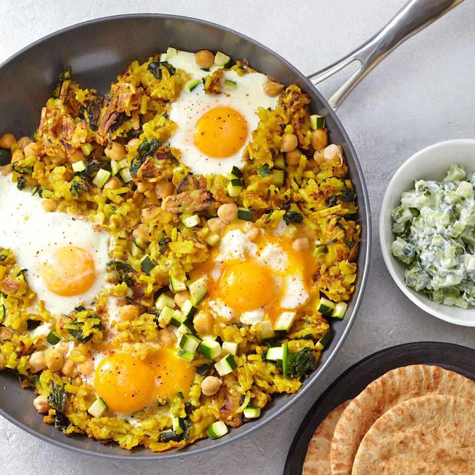 <p>The eggs cook right on top of this chickpea and potato hash--cook them a few extra minutes if you prefer hard-set eggs. Serve with warm pita bread and a cucumber salad with mint and yogurt. <a href="https://www.eatingwell.com/recipe/250486/chickpea-potato-hash/" rel="nofollow noopener" target="_blank" data-ylk="slk:View Recipe" class="link ">View Recipe</a></p>