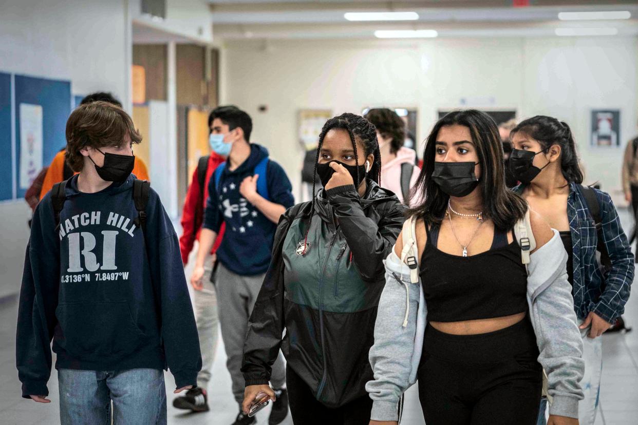 White Plains High School students walk between classes in White Plains, N.Y.