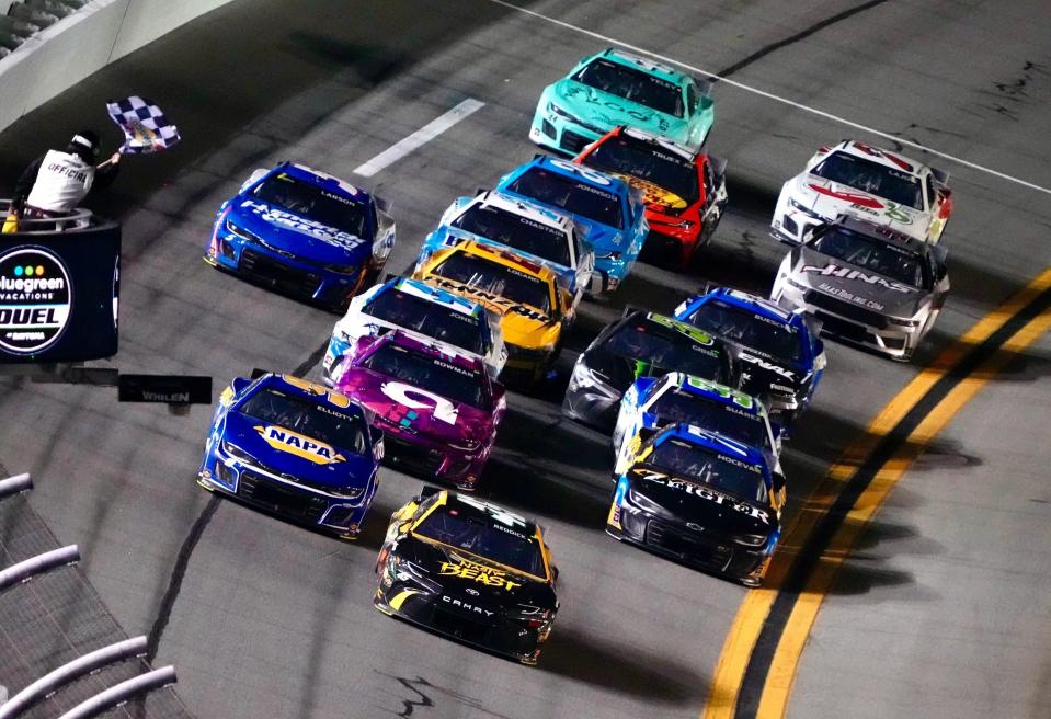 Tyler Reddick (45) beats Chase Elliott (9) to the line to win the first of two BlueGreen Vacation Duel at Daytona races on Thursday, February 15, 2024.