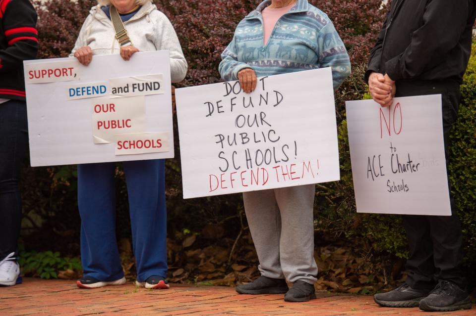 People outside the Jackson-Madison County Board of Education protest against the funding of charter school American Classical Education before the Jackson-Madison County School Board meeting on Thursday, Apr. 27, 2023. 