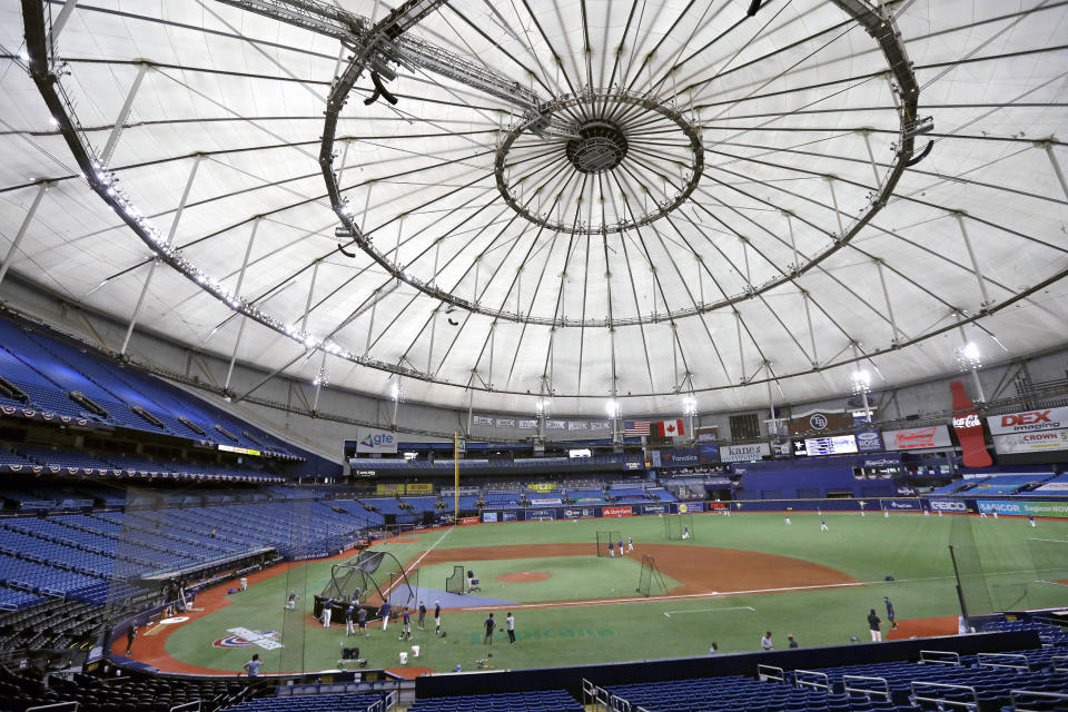 FILE - Members of the Tampa Bay Rays take batting practice at Tropicana Field before a baseball game against the Toronto Blue Jays in St. Petersburg, Fla., July 24, 2020. The Rays are pushing for swift approval of a financing deal for a new 30,000-seat ballpark, part of a much larger $6 billion redevelopment project that includes such things as affordable housing, a hotel, a Black history museum and many other items. (AP Photo/Chris O'Meara, File)