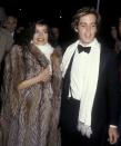 <p>The Nicaraguan actress and activist celebrated the New Year at Woody Allen's 1979 party at Harkness House in New York City. Here, she and date John Samuels, Jr., don matching scarves and she wears an oversize fur coat.</p>