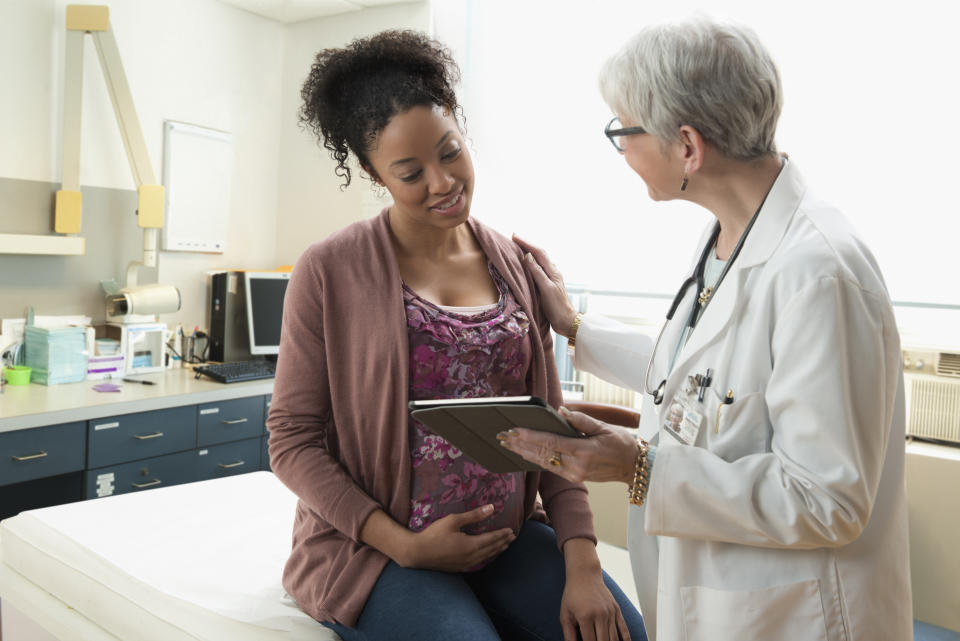 Pregnant woman at check up. (Getty Images)