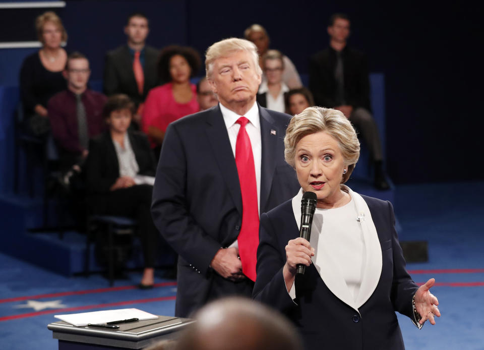 FILE - Democratic presidential nominee Hillary Clinton, right, speaks as Republican presidential nominee Donald Trump listens during the second presidential debate in St. Louis, Oct. 9, 2016. (Rick T. Wilking/Pool via AP, File)