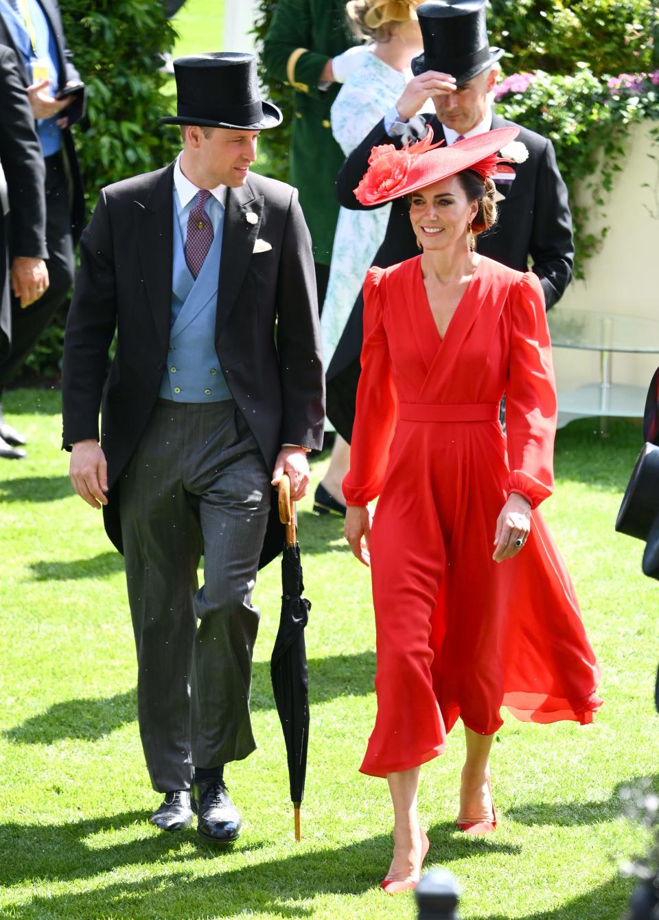 Kate Middleton wears a bight-red dress during Royal Ascot 2023, with Prince William at her side.