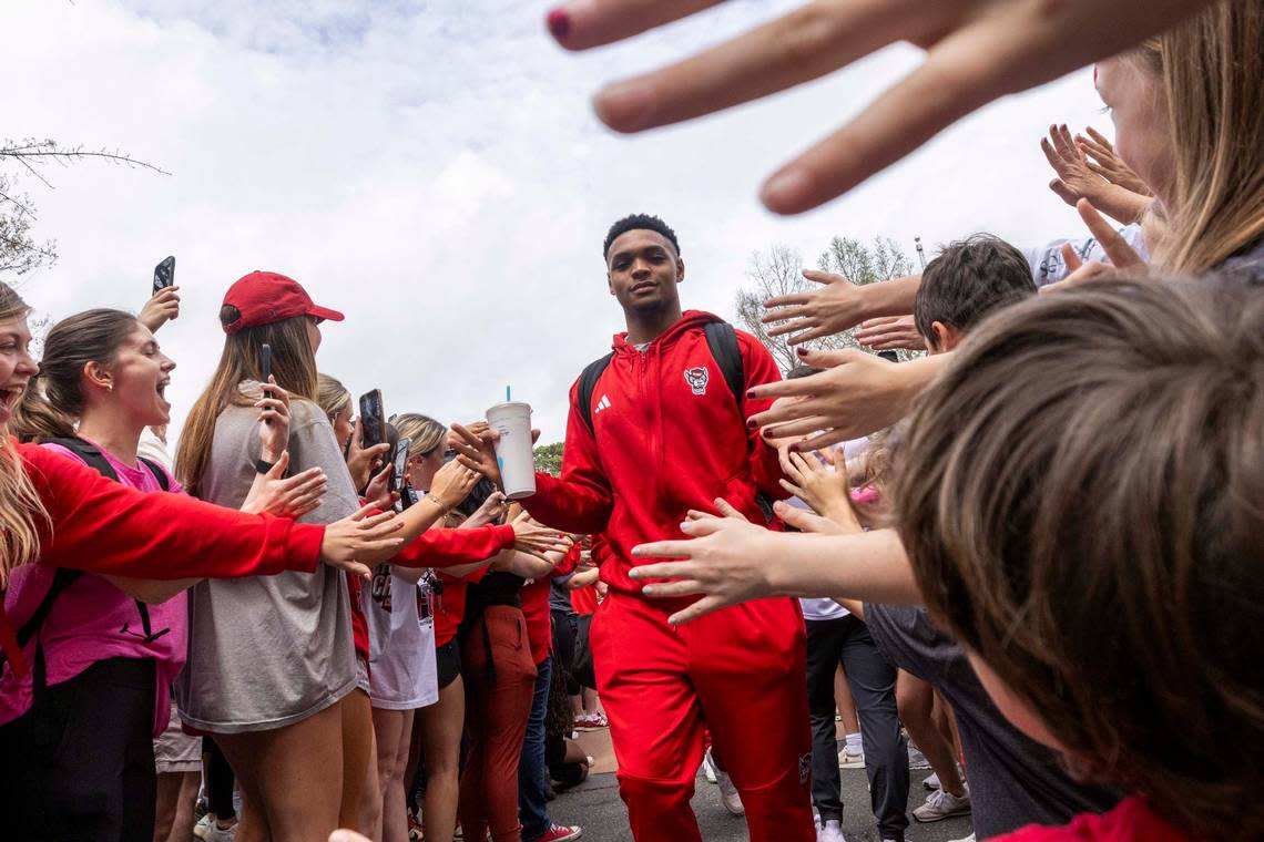 NC.State’s Casey Morsell is greeted by fans as the men’s basketball team departs on a bus Wednesday, April 3, 2024. NC State’s men’s basketball team is headed to the Final Four for the first time since 1983.