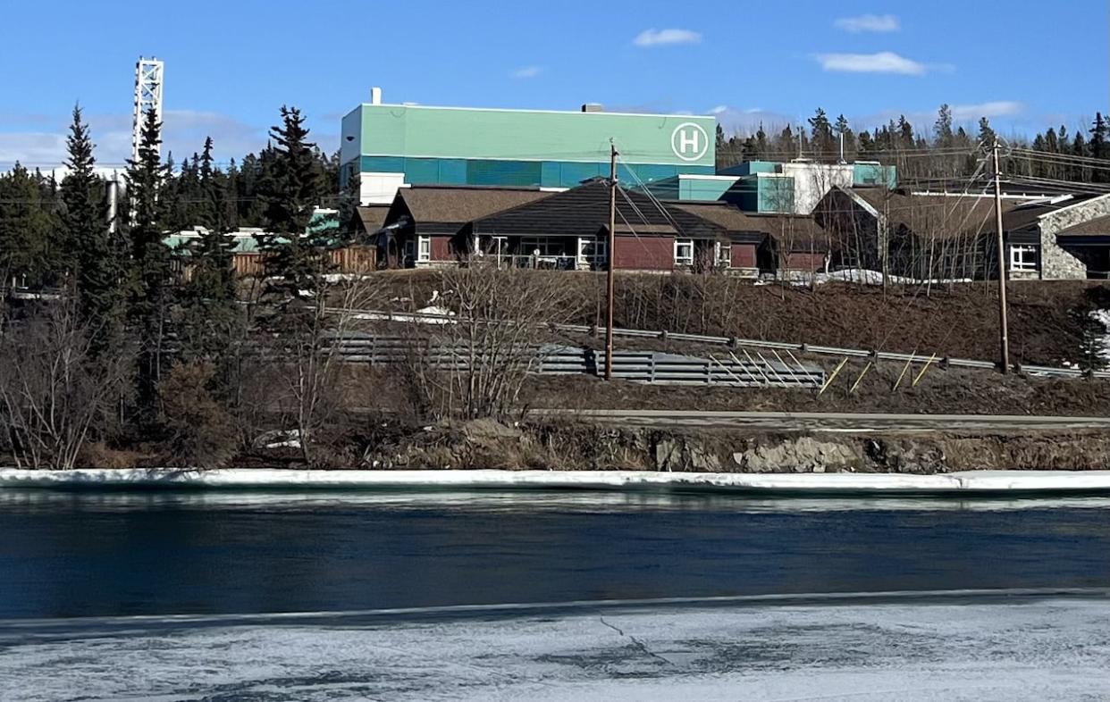 Looking across the Yukon River at the Whitehorse hospital. (Paul Tukker/CBC - image credit)