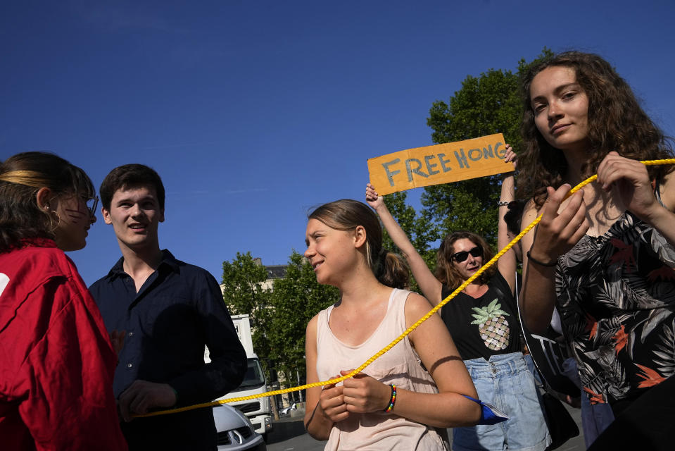 Climate activist, Greta Thunberg, center, participates in a protest on the sidelines of the Global Climate Finance Summit in Paris, Friday, June 23, 2023. World leaders, heads of international organizations and activists are gathering in Paris for a two-day summit aimed at seeking better responses to tackle poverty and climate change issues by reshaping the global financial system. (AP Photo/Michel Euler)