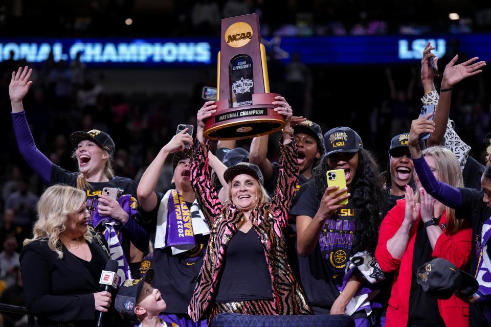 Apr 2, 2023; Dallas, TX, USA; LSU Lady Tigers head coach Kim Mulkey raises the tournament trophy after defeating the Iowa Hawkeyes during the final round of the Women's Final Four NCAA tournament at the American Airlines Center. Mandatory Credit: Kirby Lee-USA TODAY Sports