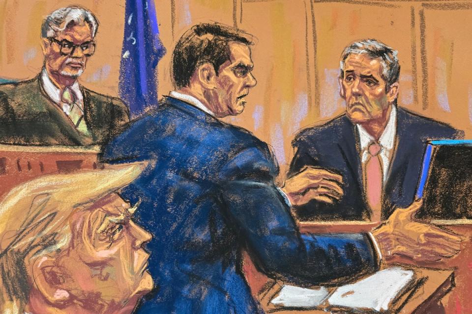 Michael Cohen is cross examined by defense lawyer Todd Blanche before Justice Juan Merchan, as former U.S. President Donald Trump watches during Trump's criminal trial on charges that he falsified business records to conceal money paid to silence porn star Stormy Daniels in 2016, in Manhattan state court in New York City, U.S. May 20, 2024 (REUTERS)