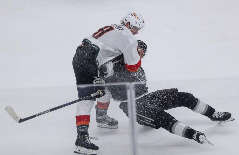 Coachella Valley Firebird Cale Fleury, 8, puts a check on an Ontario Reign player at Acrisure Arena in Palm Desert, Calif., Oct. 25, 2023.