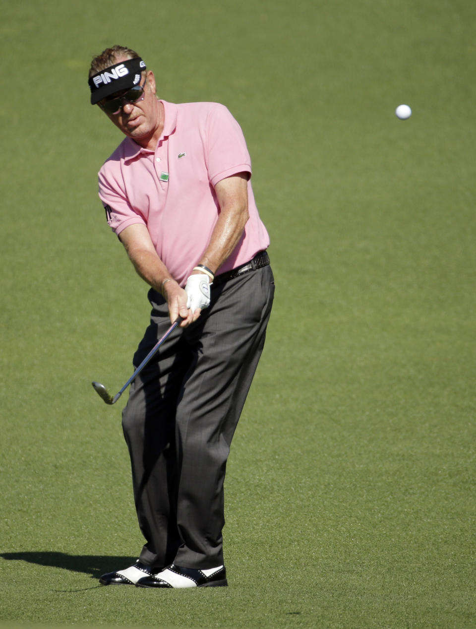 Miguel Angel Jimenez, of Spain, hits to the second green during the first round of the Masters golf tournament Thursday, April 10, 2014, in Augusta, Ga. (AP Photo/Chris Carlson)