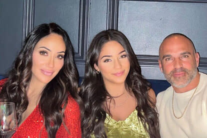 Melissa Gorga, Joe Gorga, and Antonia Gorga sitting together at dinner.