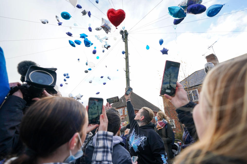 People release balloons during a tribute to six-year-old Arthur Labinjo-Hughes outside Emma Tustin's former address in Solihull, West Midlands, where he was murdered by his stepmother. Picture date: Sunday December 5, 2021.