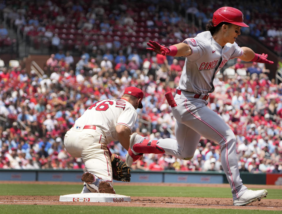 Cincinnati Reds' Stuart Fairchild, right, is safe at first for a single as St. Louis Cardinals first baseman Paul Goldschmidt handles the throw during the second inning of a baseball game Saturday, June 10, 2023, in St. Louis. (AP Photo/Jeff Roberson)