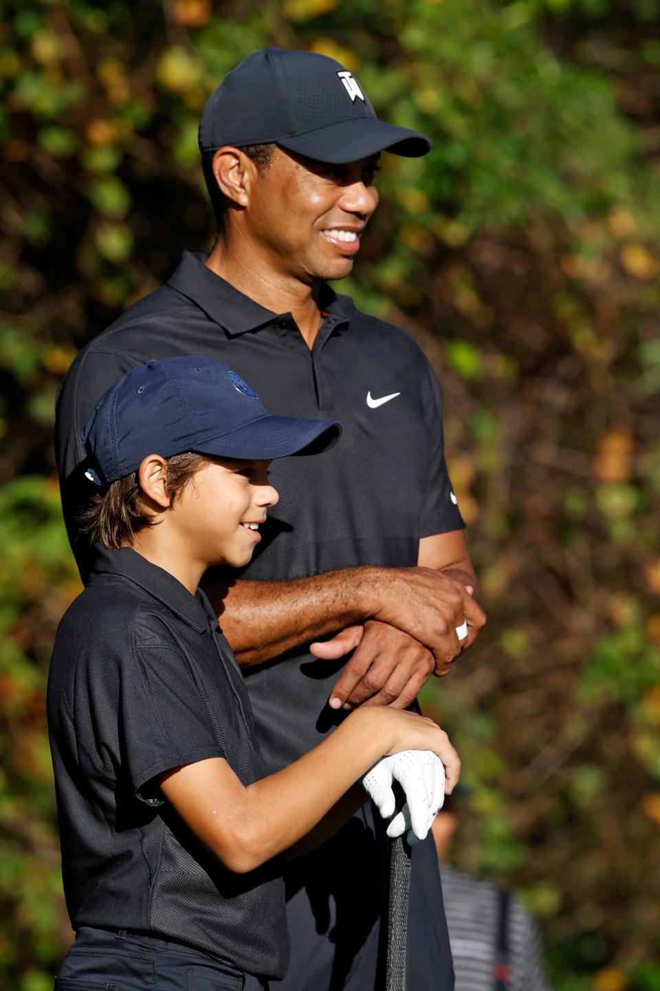 Tiger Woods with his son Charlie as they prepare to tee off Friday at the PNC Championship.