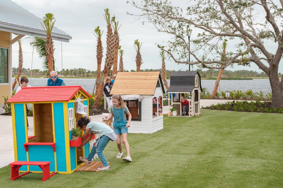 Children play in the Habitat Cottages on the Canopy Green between Solis Hall and the Banyan House Restaurant. The cottages were constructed by builders at Wellen Park and will eventually be given to families who live in homes built through Habitat for Humanity. But before that, people can vote for their favorite cottage, with Wellen Park contributing $1 for each vote as part of a Habitat fundraiser. Ultimately, people can bid on their favorite cottage at a silent auction, which also will be a Habitat fundraiser.
