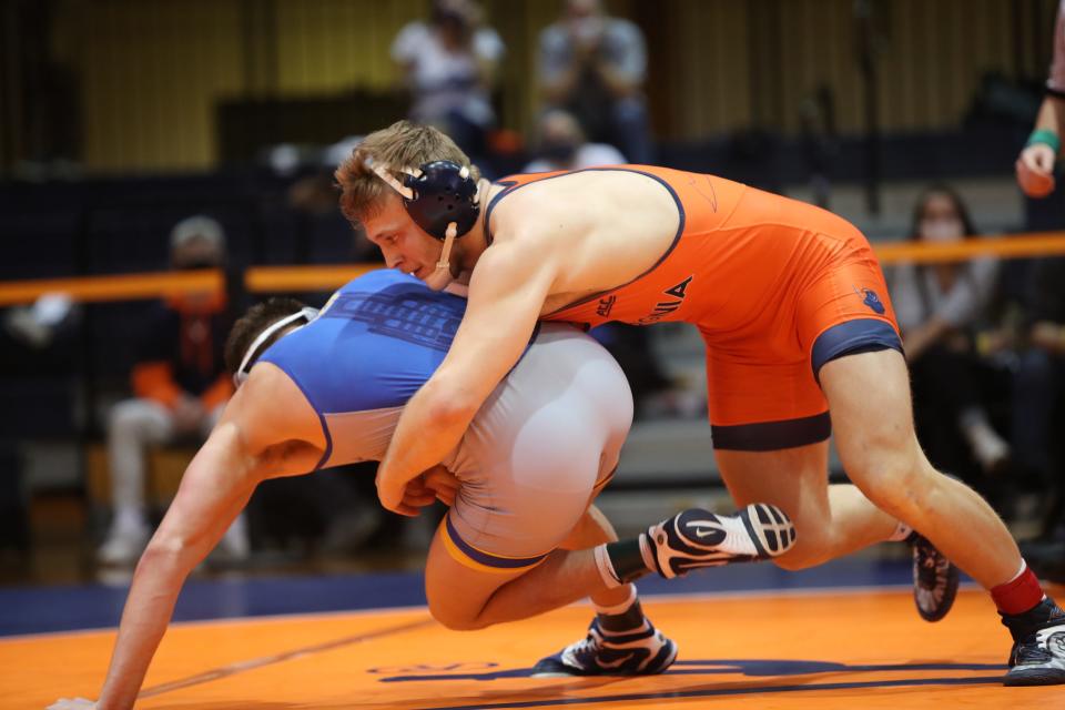 Vic Marcelli (right), a Jackson High School graduate, in action during the 2020-21 season for the University of Virginia wrestling team.