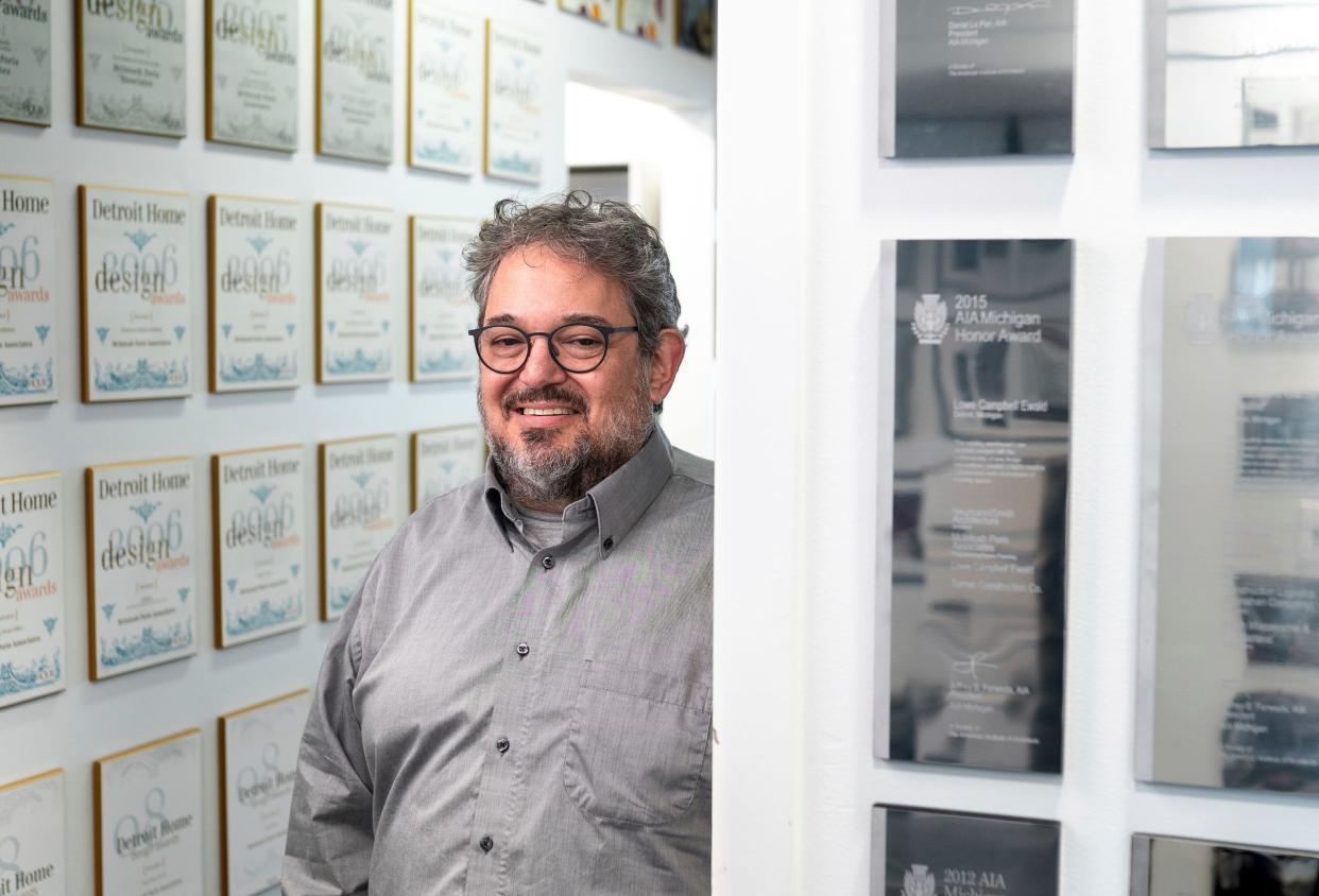 McIntosh Poris Architects founding principal Michael Poris stands near awards that line the walls of his business in Birmingham on Monday, March 11, 2024.