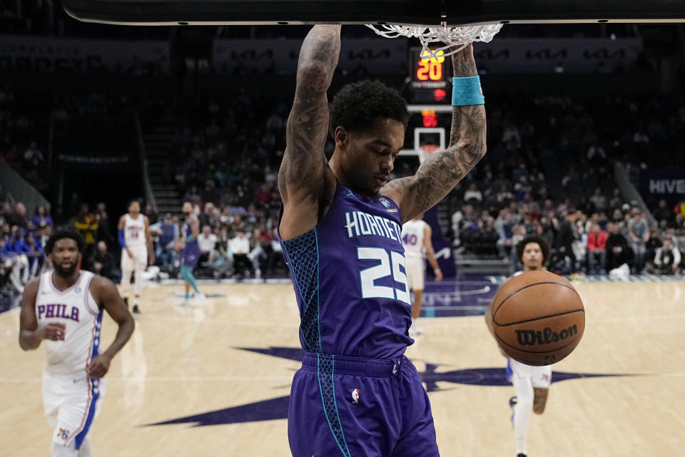 Charlotte Hornets forward P.J. Washington dunks against the Philadelphia 76ers during the first half of an NBA basketball game on Saturday, Jan. 20, 2024, in Charlotte, N.C. (AP Photo/Chris Carlson)