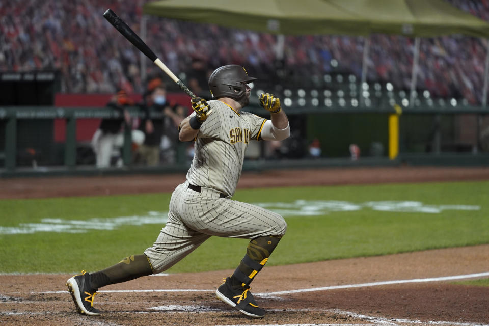 San Diego Padres' Mitch Moreland watches an RBI single against the San Francisco Giants during the fourth inning of a baseball game in San Francisco, Saturday, Sept. 26, 2020. (AP Photo/Eric Risberg)